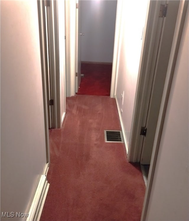 corridor with dark carpet