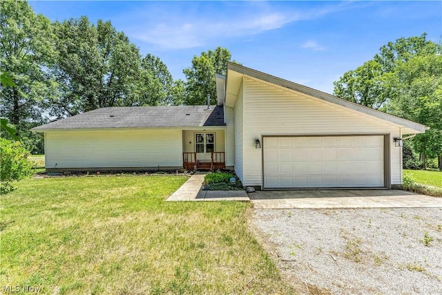 view of front of property with a front lawn and a garage