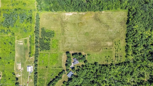 birds eye view of property with a rural view