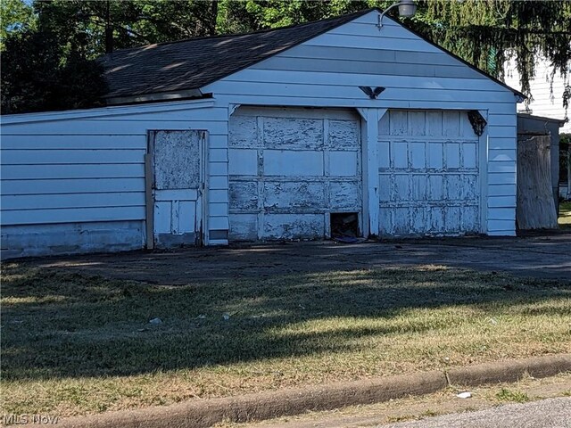 garage with a lawn