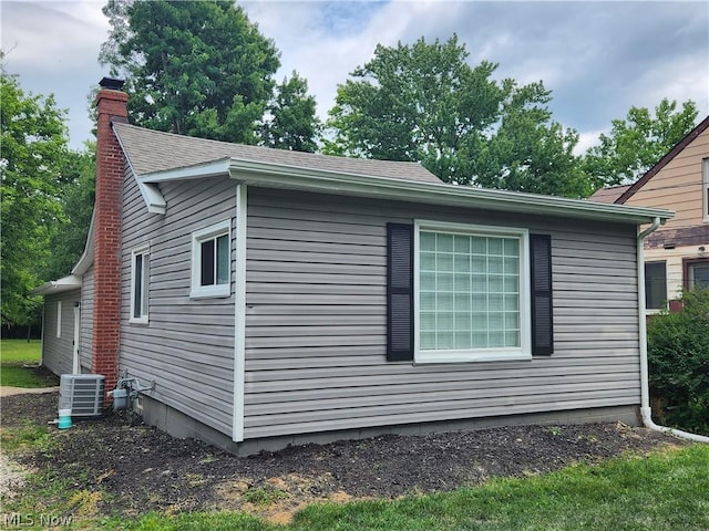 view of side of property featuring central AC unit