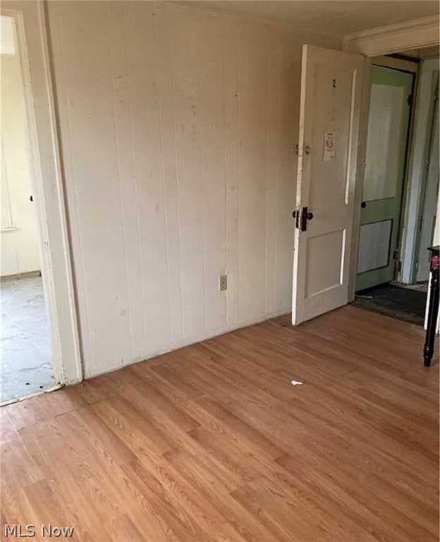 spare room with hardwood / wood-style flooring