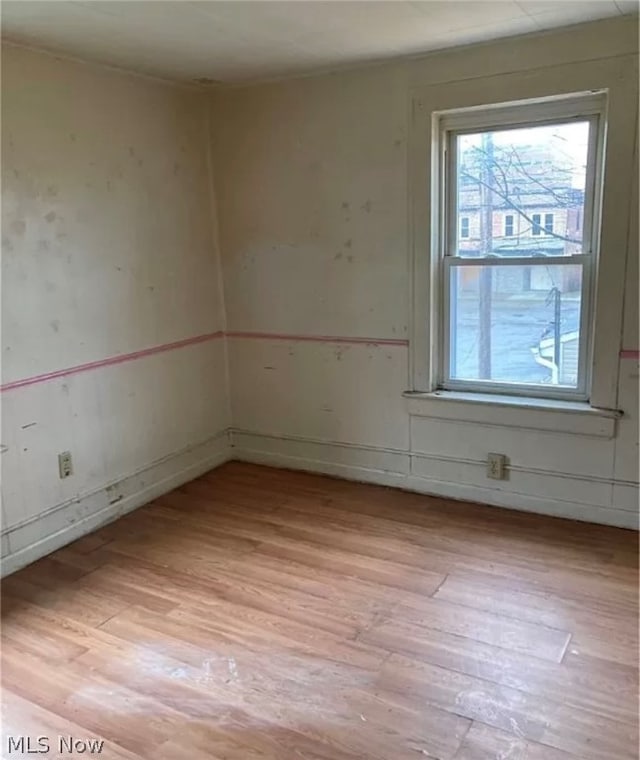 unfurnished room featuring light wood-type flooring