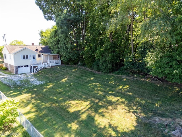 view of yard featuring a wooden deck