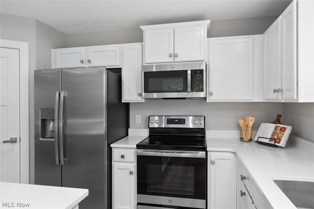 kitchen featuring white cabinets and stainless steel appliances