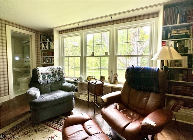 sitting room with hardwood / wood-style flooring