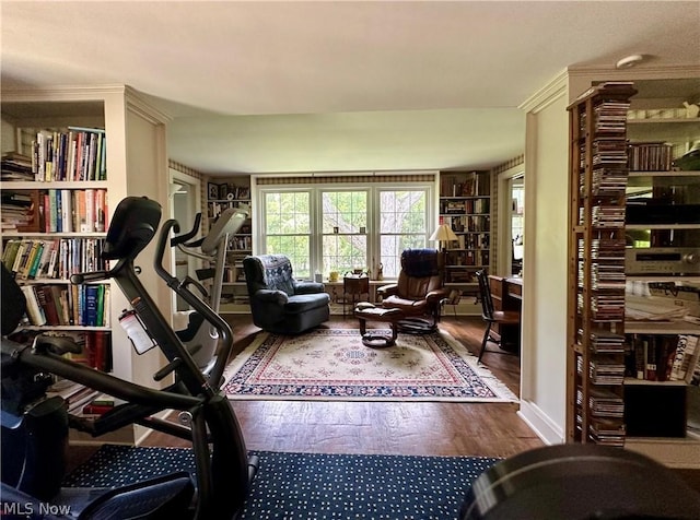 interior space featuring hardwood / wood-style flooring and ornamental molding