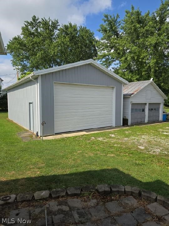 garage with a lawn