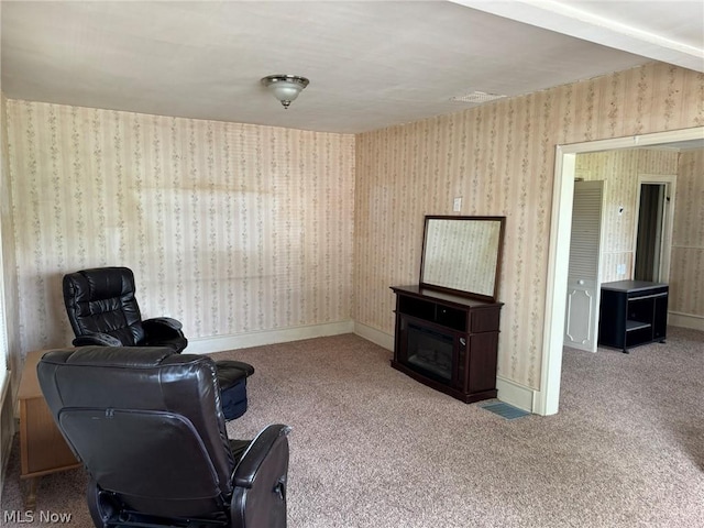 living area featuring carpet flooring