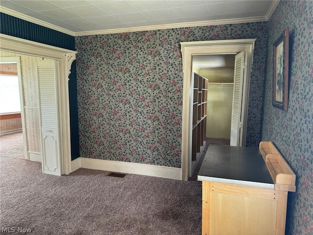 interior space with carpet and crown molding