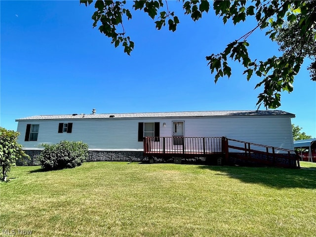 view of front of property featuring a front lawn and a wooden deck