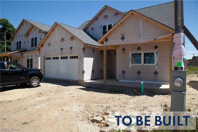 unfinished property with a garage