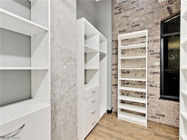 walk in closet featuring light hardwood / wood-style floors