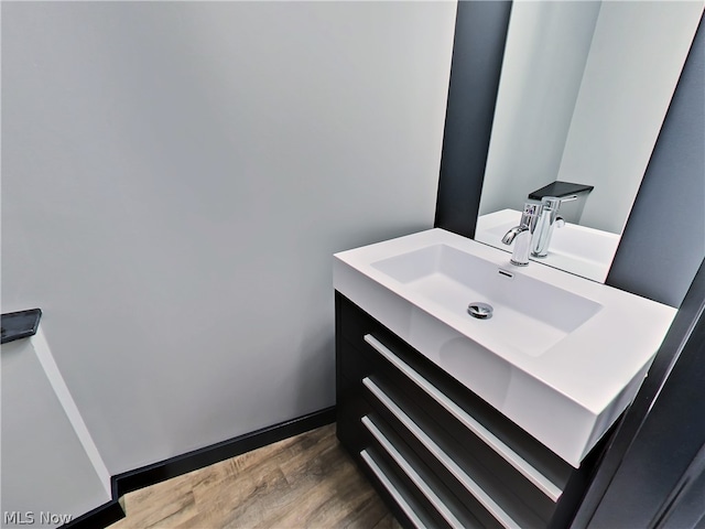 bathroom featuring vanity and wood-type flooring