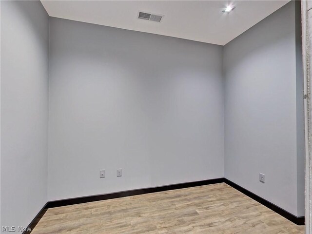 unfurnished room featuring wood-type flooring