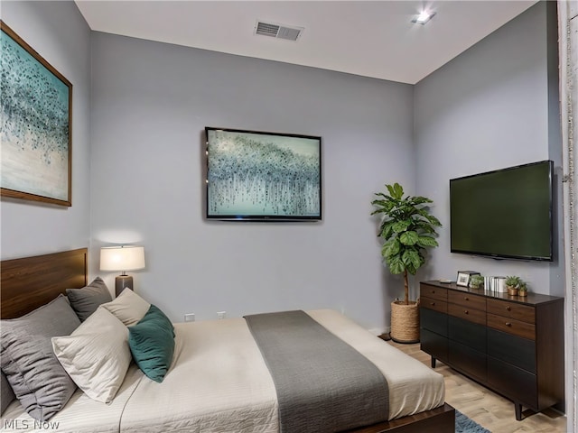 bedroom with light wood-type flooring