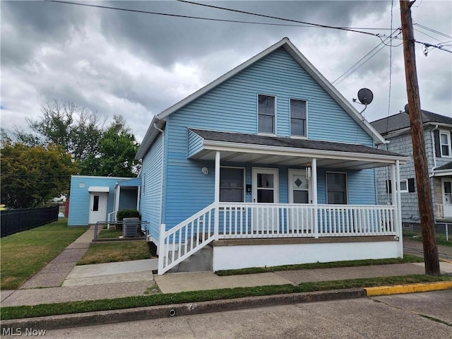 bungalow-style home with a porch and a front lawn