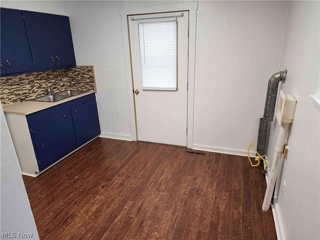 interior space featuring dark hardwood / wood-style flooring and sink