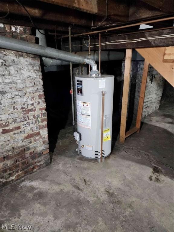 utility room featuring gas water heater