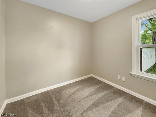 empty room with carpet flooring