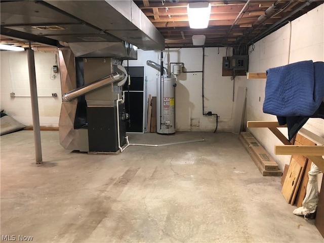 basement with heating unit, water heater, and electric panel