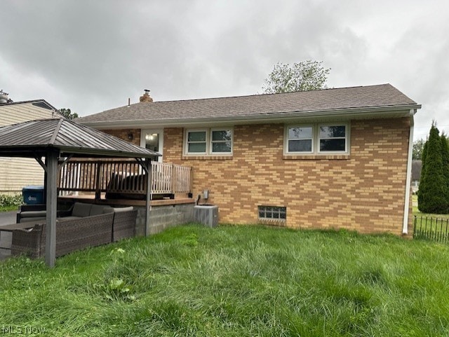 back of house featuring a gazebo, a yard, cooling unit, and a wooden deck