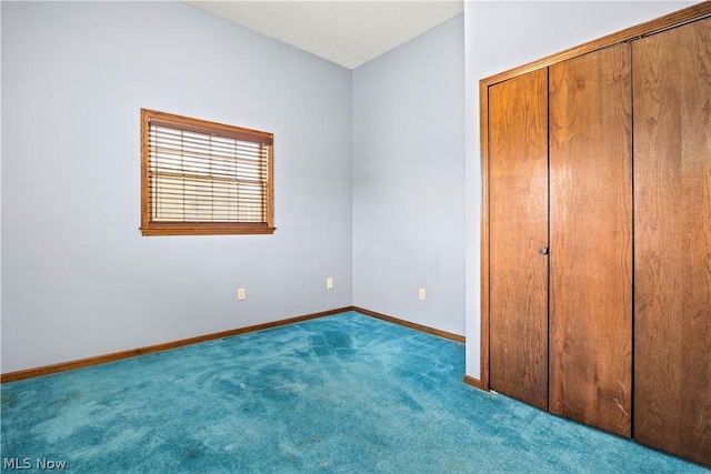 unfurnished bedroom with carpet flooring and a closet