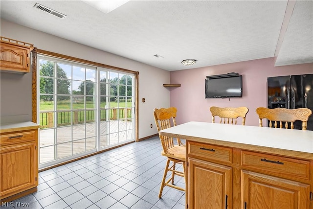 dining area with light tile patterned flooring