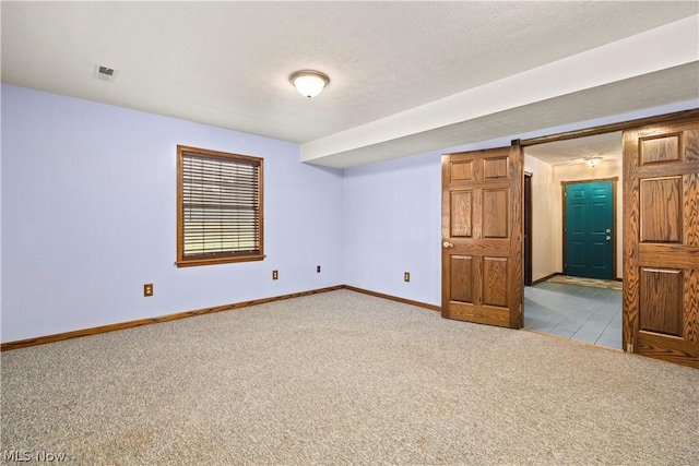 unfurnished room featuring light colored carpet