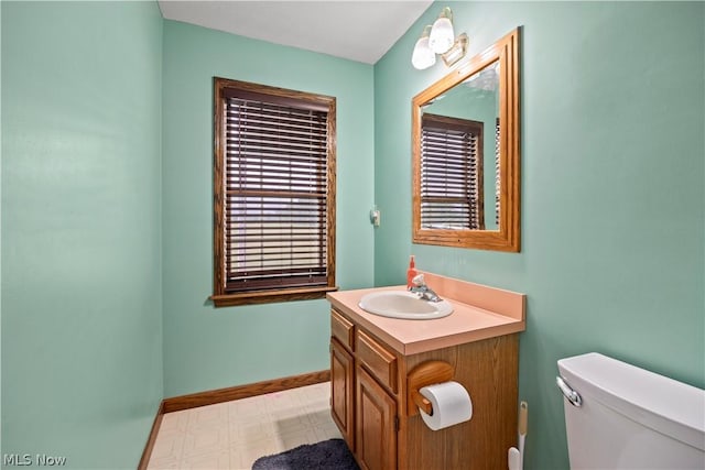 bathroom featuring vanity and toilet