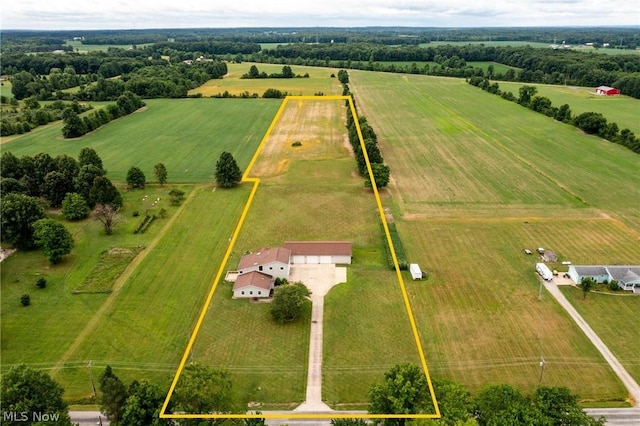 birds eye view of property with a rural view