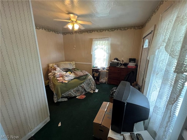 carpeted bedroom with ceiling fan