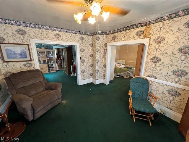 living area featuring dark colored carpet