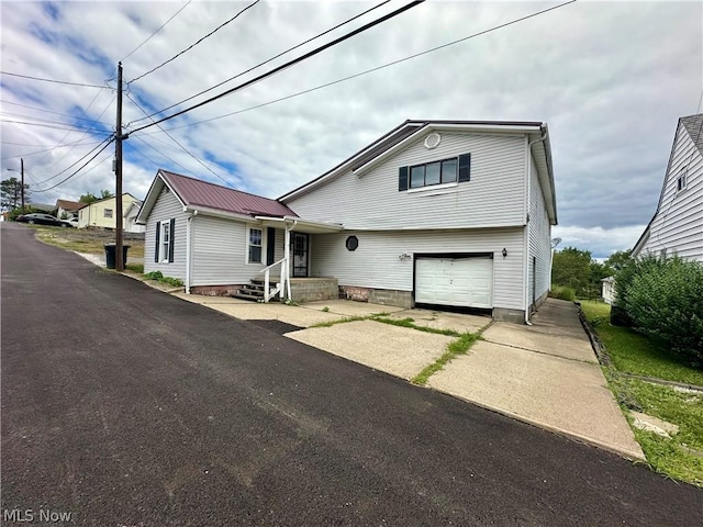 view of front of property with a garage