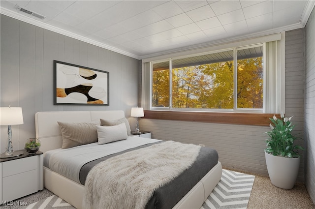 bedroom with ornamental molding, light carpet, and wood walls