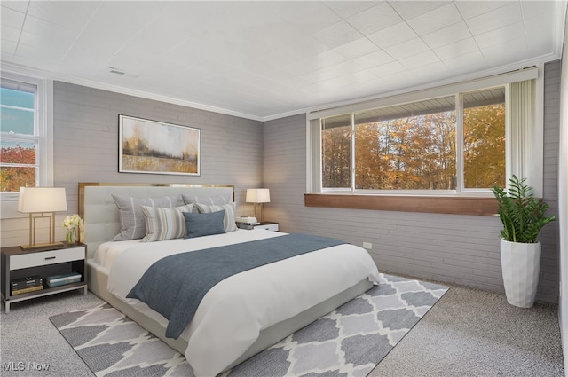 carpeted bedroom with crown molding