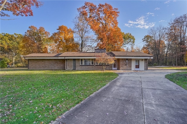 ranch-style home featuring a front yard