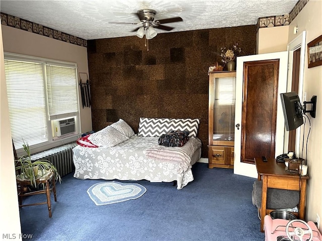 bedroom featuring carpet, a textured ceiling, radiator heating unit, and cooling unit