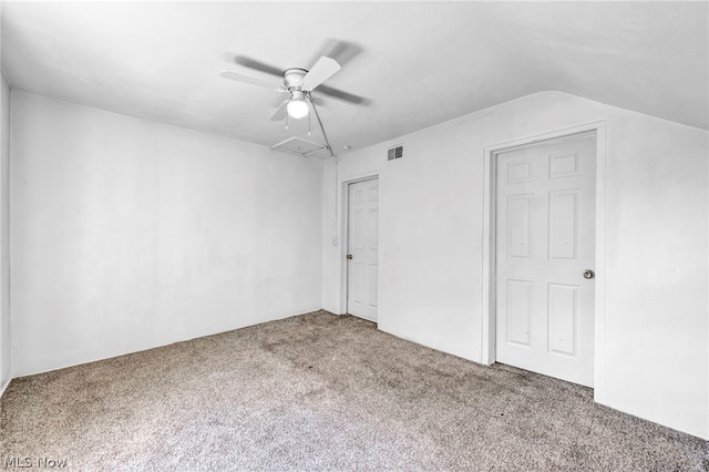 unfurnished bedroom featuring ceiling fan, carpet floors, and lofted ceiling