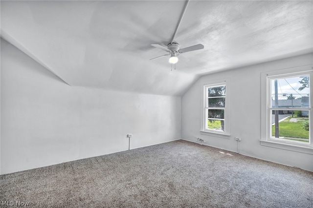 bonus room featuring carpet floors, vaulted ceiling, and ceiling fan