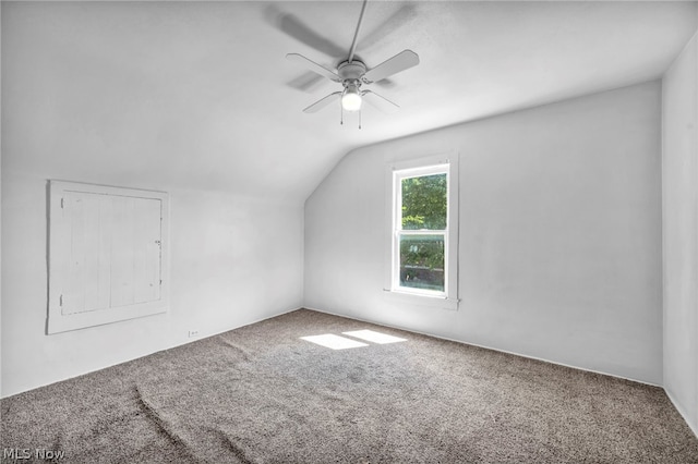 additional living space with ceiling fan, carpet, and vaulted ceiling