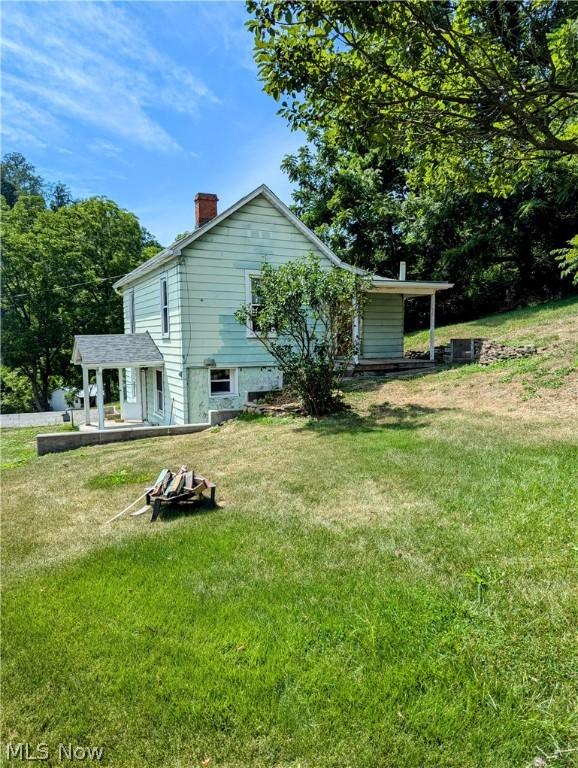 view of property exterior featuring a yard