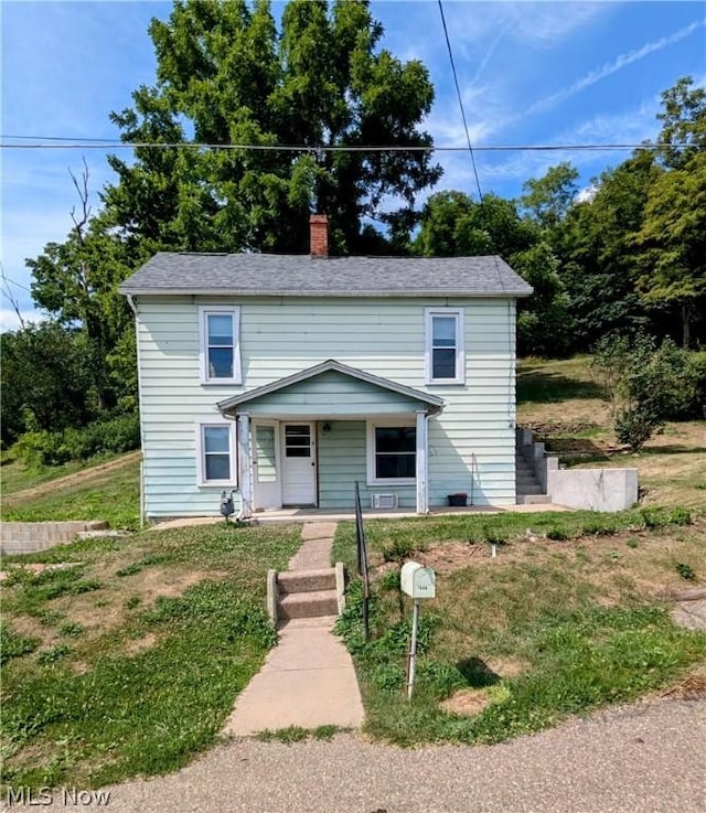 front facade featuring a front yard and a porch