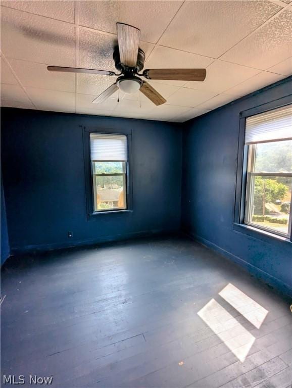 spare room featuring hardwood / wood-style flooring and ceiling fan