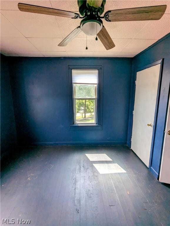 empty room with dark hardwood / wood-style flooring