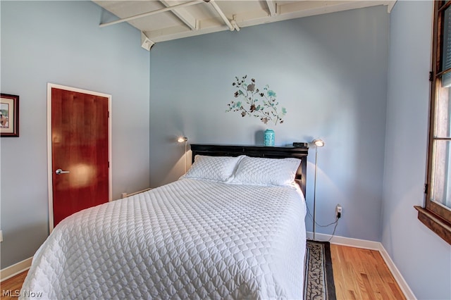 bedroom with wood-type flooring