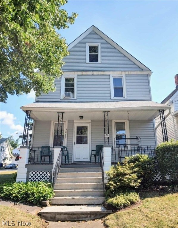 view of front facade featuring a porch and cooling unit