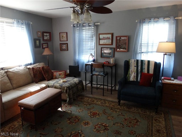 living room featuring hardwood / wood-style flooring and ceiling fan