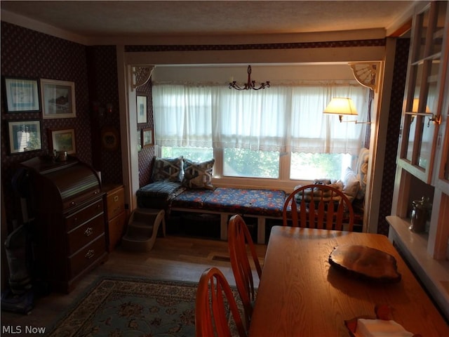 dining space with hardwood / wood-style flooring