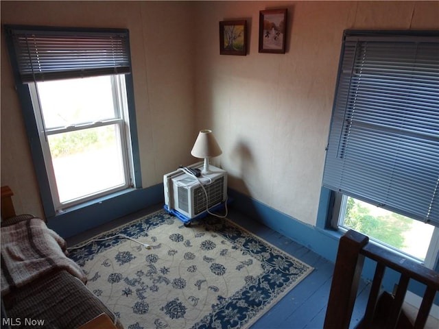 living area with hardwood / wood-style flooring